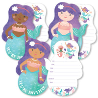 A set of mermaid-shaped fill-in invitations with space to add party details, accompanied by white envelopes. The invitations feature illustrated mermaids with different skin tones and accessories.