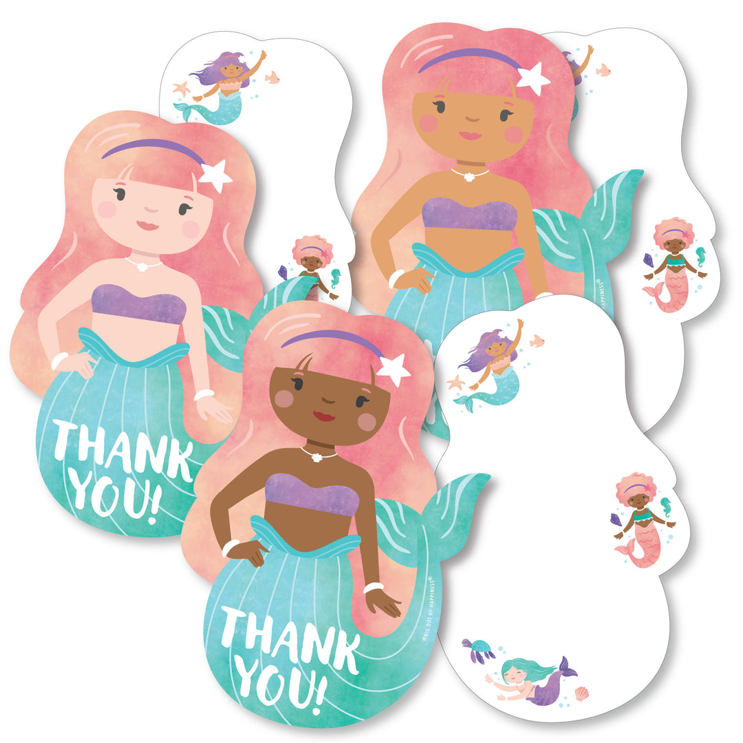 A set of white thank you cards with mermaid shapes, featuring multicolored mermaids on the front with the text 'THANK YOU' and a space for a personal message.