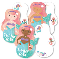 A set of white thank you cards with mermaid shapes, featuring multicolored mermaids on the front with the text 'THANK YOU' and a space for a personal message.