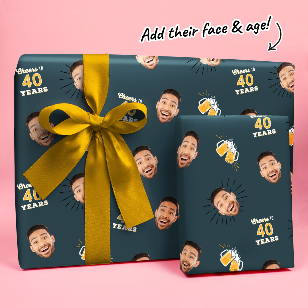 Gift box with a face pattern and yellow ribbon on a pink background