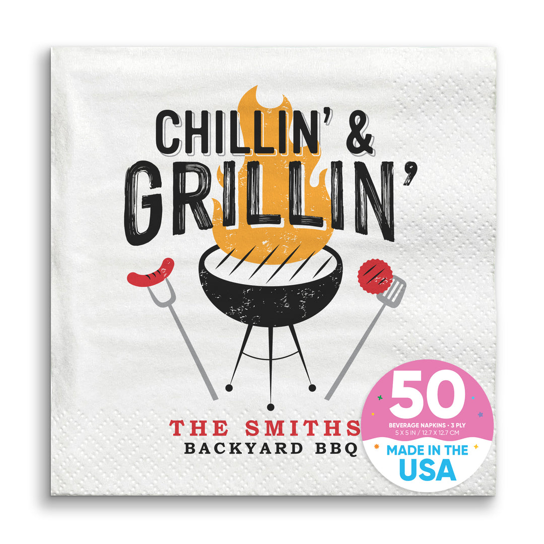 A white paper napkin with 'CHILLIN' & GRILLIN" text and an illustration of a grill and utensils. Custom text reads 'THE SMITHS' BACKYARD BBQ'.