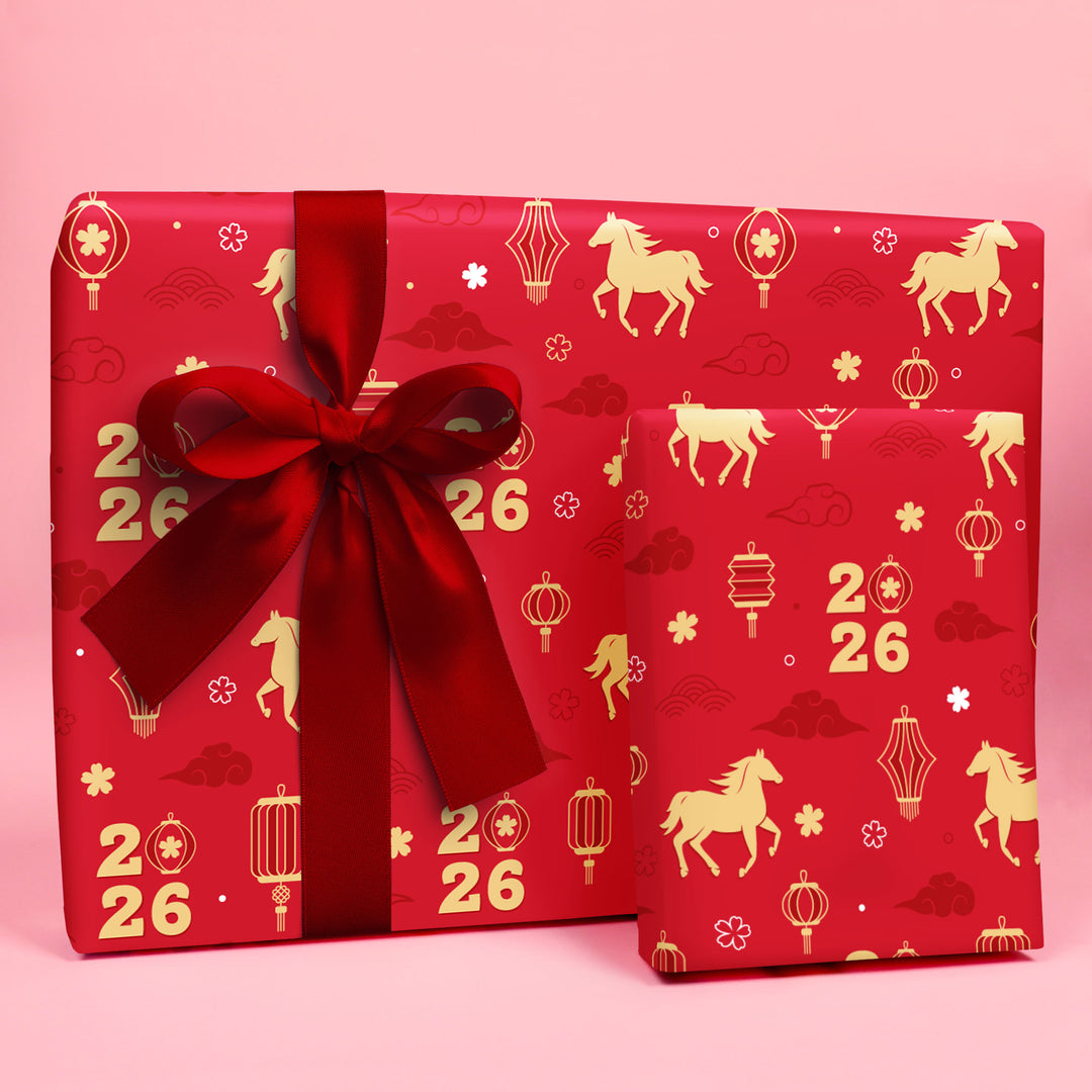 lunar new year 2026 Red gift box with gold patterns and a large red bow on a pink background
