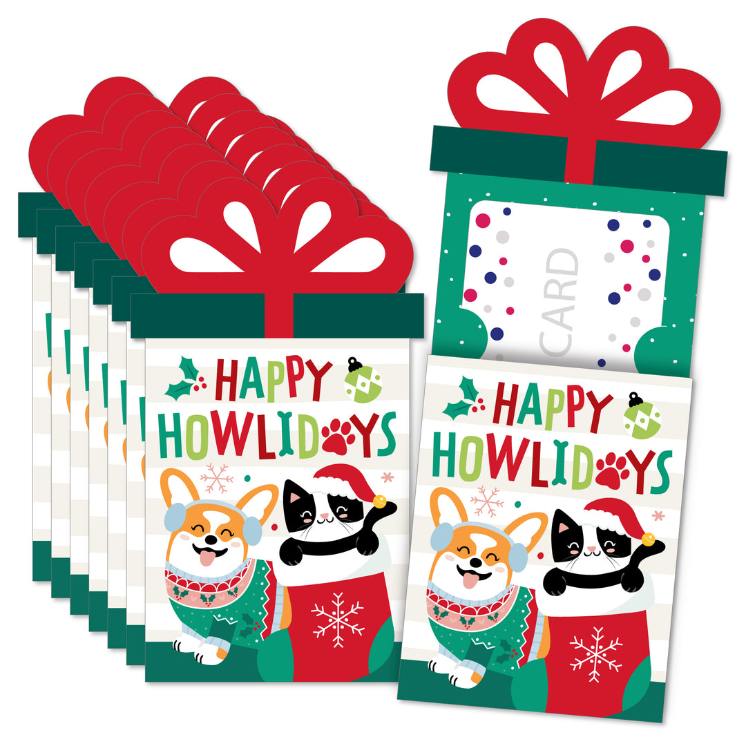 A set of Christmas-themed gift card holders featuring illustrations of cats and dogs wearing holiday clothing, with a red gift bow design on the top. Includes white envelopes with 'Happy Howliday' text printed on them.
