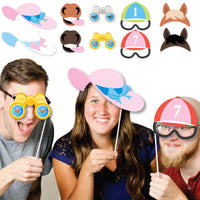 Guests using Derby props at country club party
