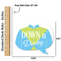 Decorative prop with 'Down n' Derby' text next to a ruler for size reference.
