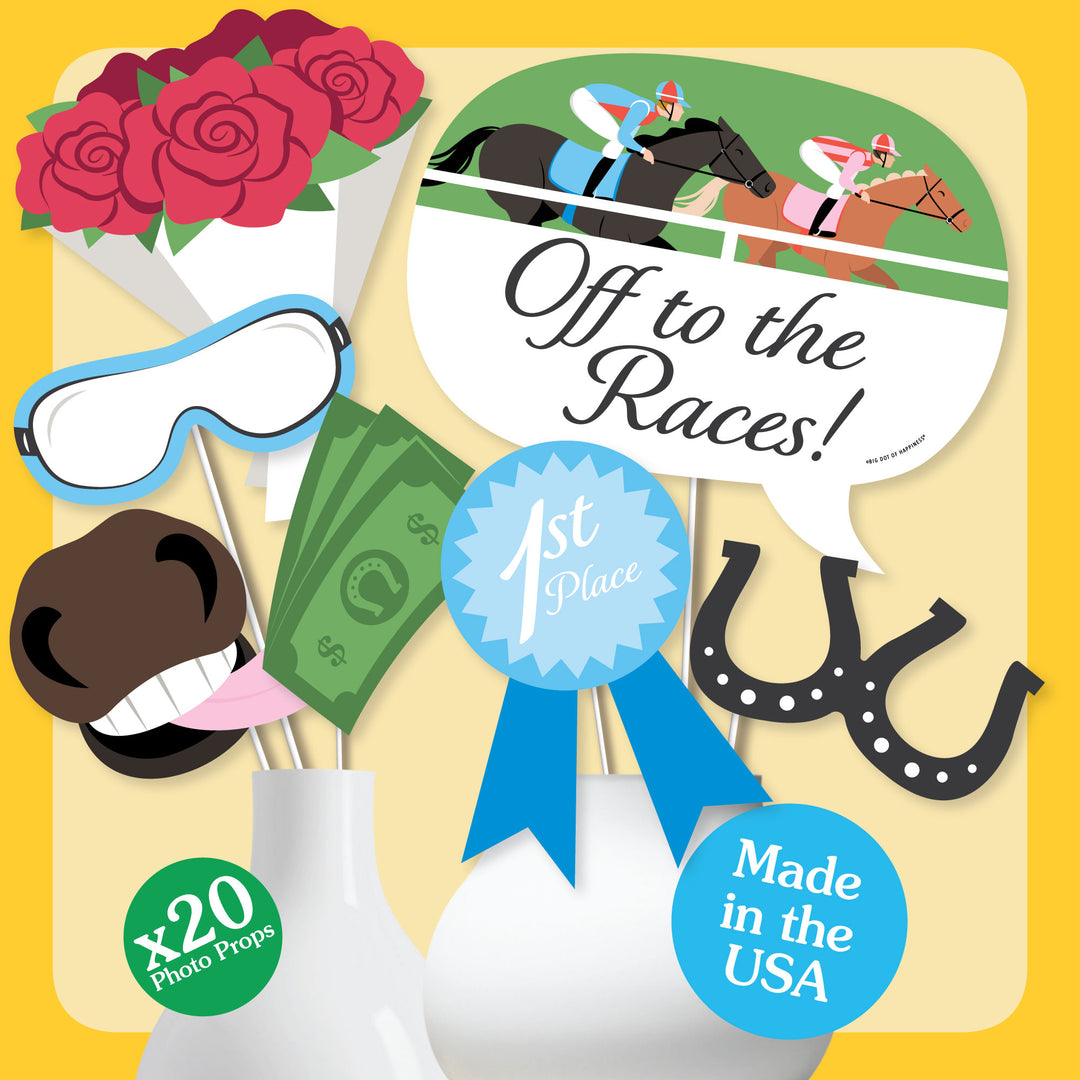 Styled Derby Day photo booth setup with props
