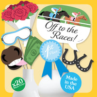 Styled Derby Day photo booth setup with props