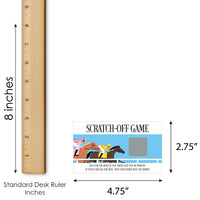 Scratch-off game card with horse racing design next to a ruler for size reference