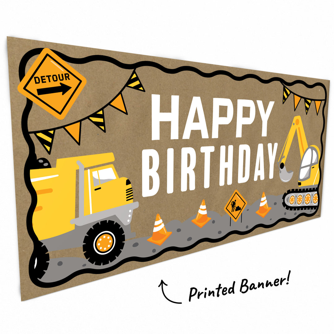 Close-up of yellow trucks and caution cone artwork