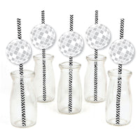 A set of paper straw decorations with striped patterns and disco ball shapes on them, displayed alongside clear glass bottles and jars.