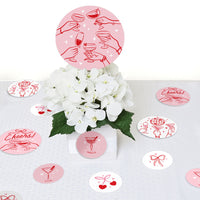 red and pink confetti pieces bows cherries cocktails detail view