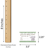 Measurement chart showing an elephant game card next to a ruler for scale.