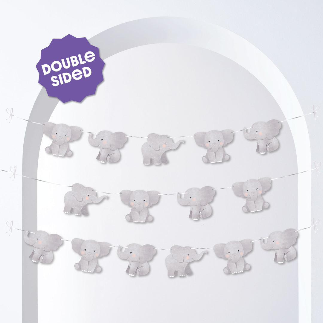 Decorative arch with double-sided baby elephant-themed party decorations on a white background