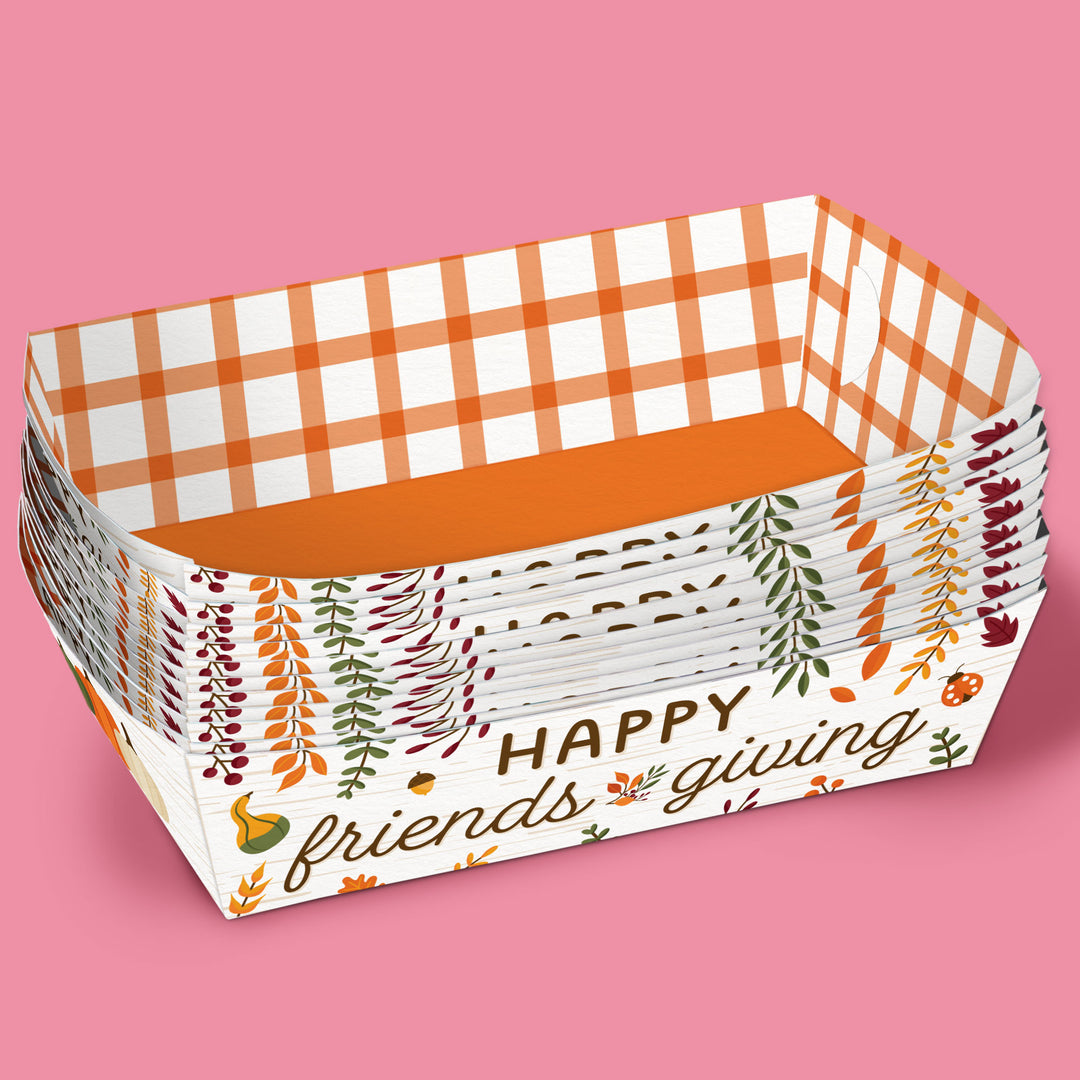 Stack of paper trays with 'Happy Friends Giving' text and checkered design on a pink background