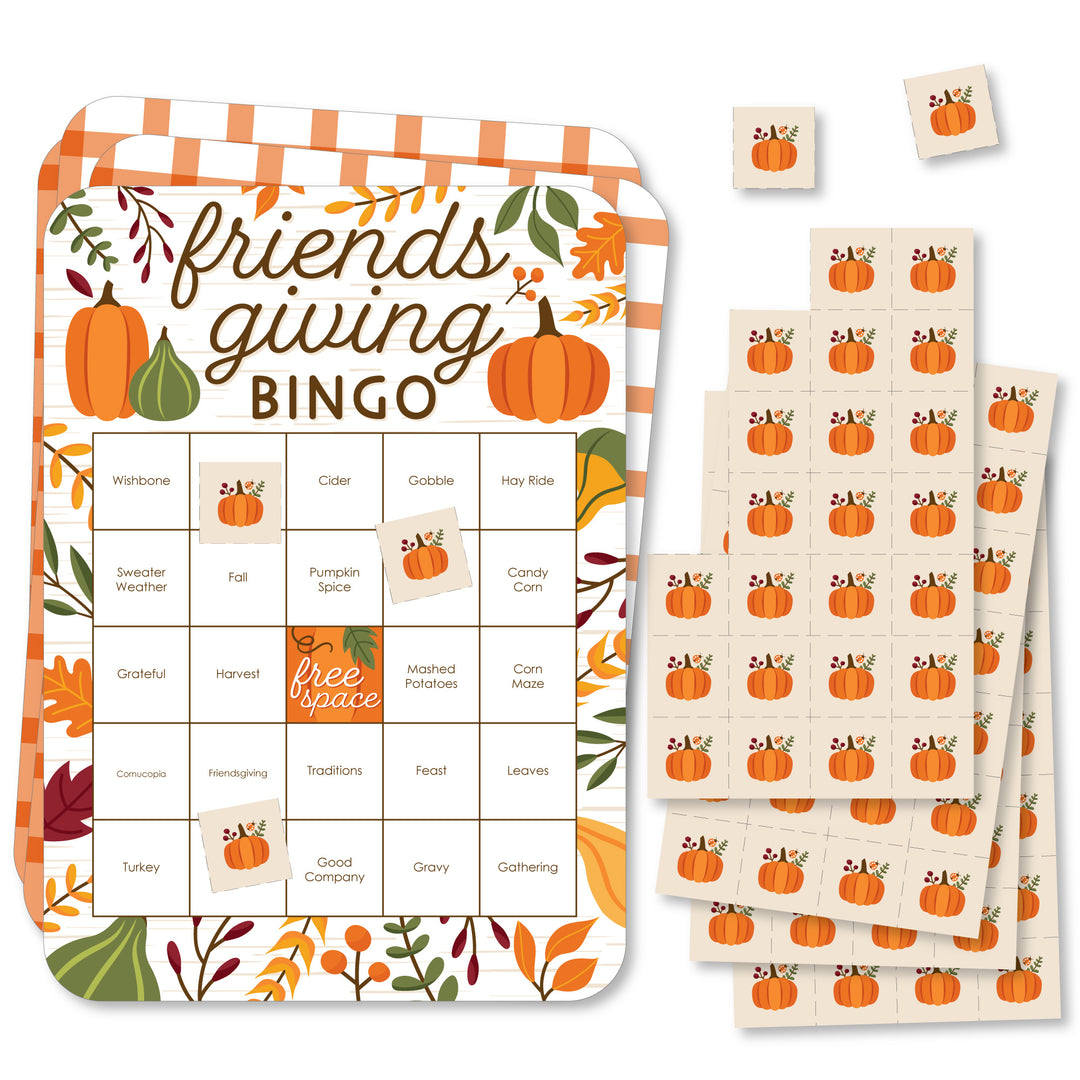 A set of rectangular bingo cards with fall-themed decorations and markers, labeled 'friendsgiving BINGO'.