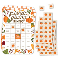 A set of rectangular bingo cards with fall-themed decorations and markers, labeled 'friendsgiving BINGO'.
