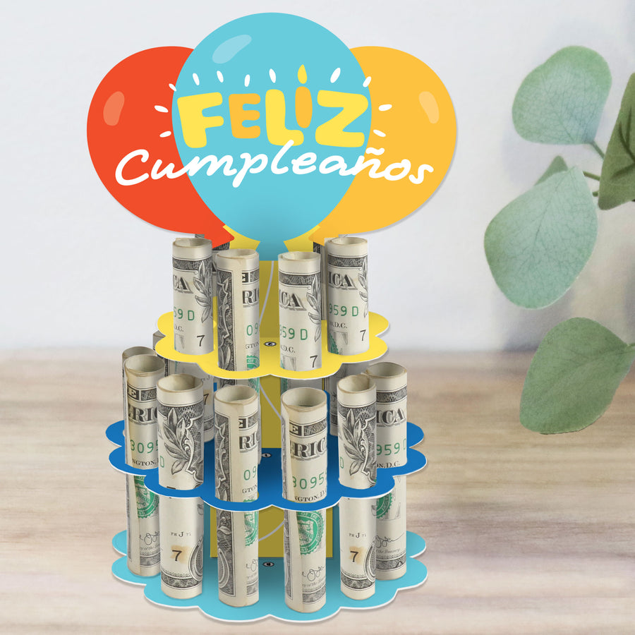 A colorful DIY balloon-themed cash cake gift stand with 'Feliz Cumpleaños' text, made from cardboard and designed to hold rolled-up cash for a birthday celebration.