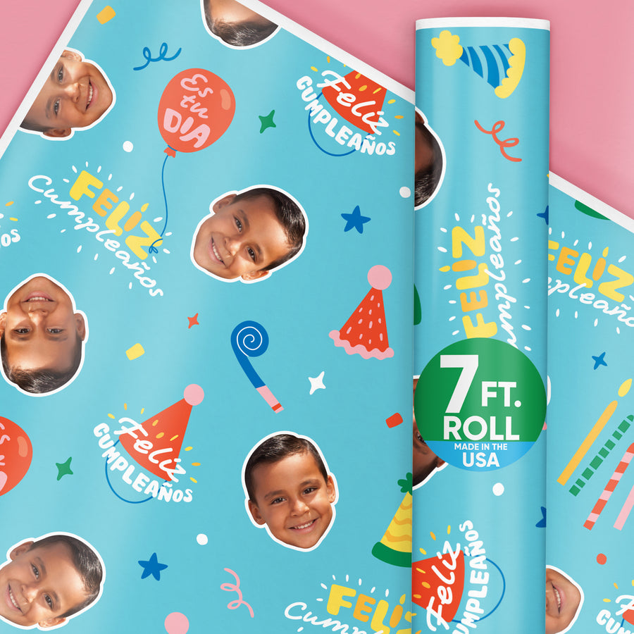 A roll of custom Feliz Cumpleaños wrapping paper with a photo upload option, decorated with colorful birthday-themed graphics and text, indicating a 7-foot roll made in the USA.