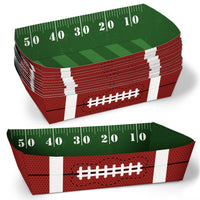 A stack of disposable paper food trays designed to look like a football field, with yard lines and a white football pattern on a red background.