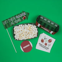 Big Game Food Tray Popcorn bowl with game-themed accessories on a green background