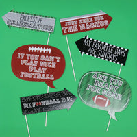 Set of football-themed photo booth props on a green background