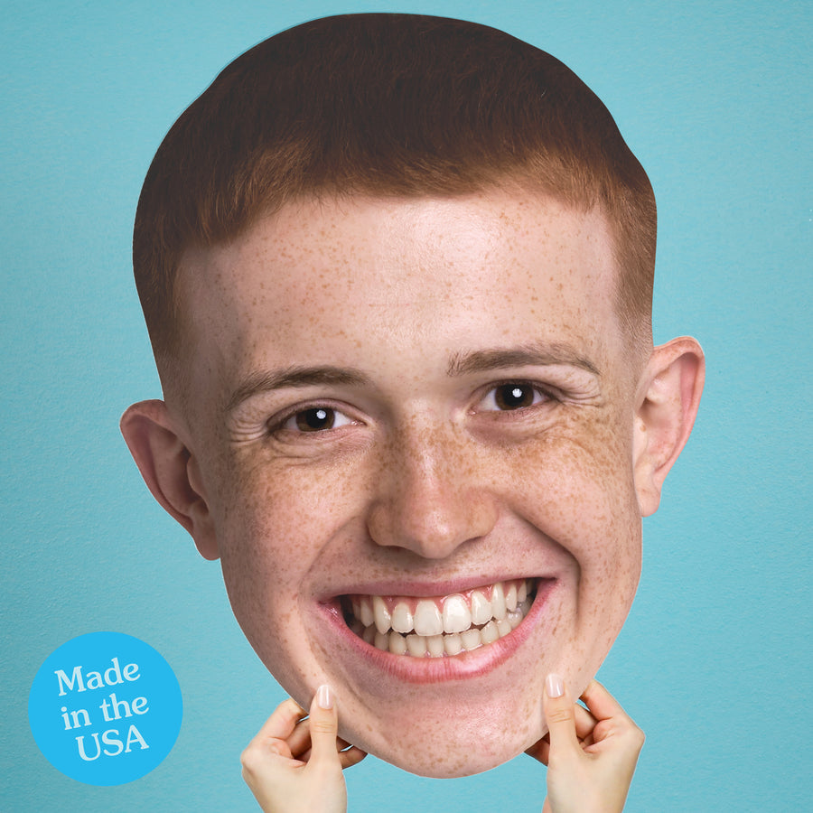 Custom Plastic cutout of a smiling person with freckles against a blue background, featuring 'Made in the USA' label.