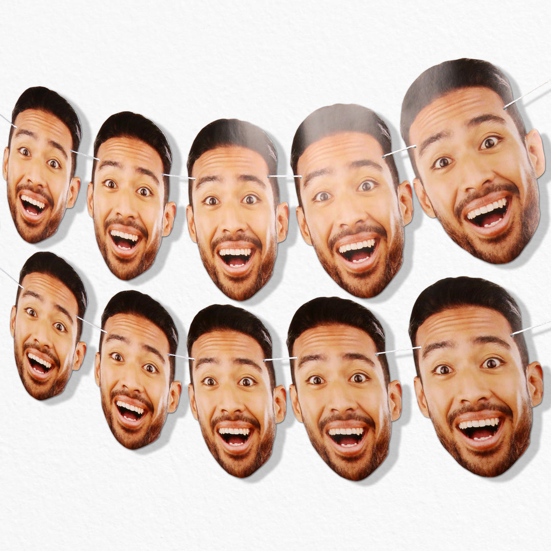 A series of 10 custom oversized face cutouts strung together with white satin cording, featuring a person smiling.