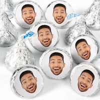 A collection of round candy stickers with a custom photo of a smiling person printed on them, displayed on a white background.