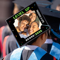 Graduation cap styled with video game photo topper