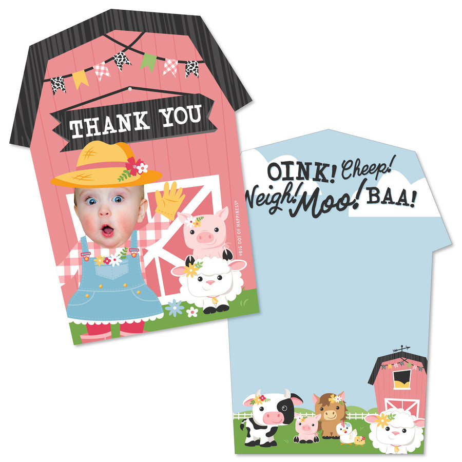 A set of personalized thank you cards with a pink barn shape and illustrations of farm animals, accompanied by white envelopes.