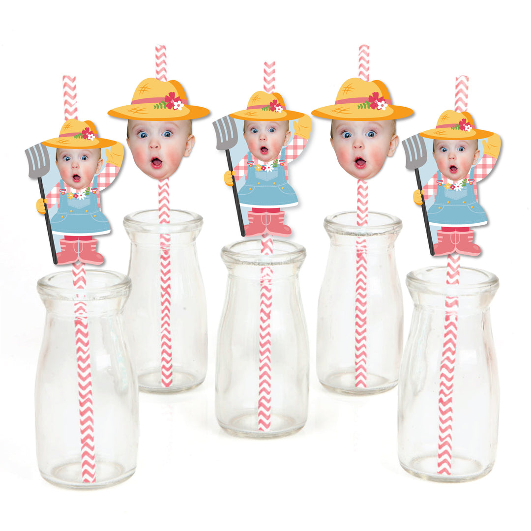 A collection of paper straw decorations with illustrated characters resembling farm animals, predominantly in pink and yellow colors, with clear striped straws and decorative elements.