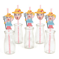 A collection of paper straw decorations with illustrated characters resembling farm animals, predominantly in pink and yellow colors, with clear striped straws and decorative elements.