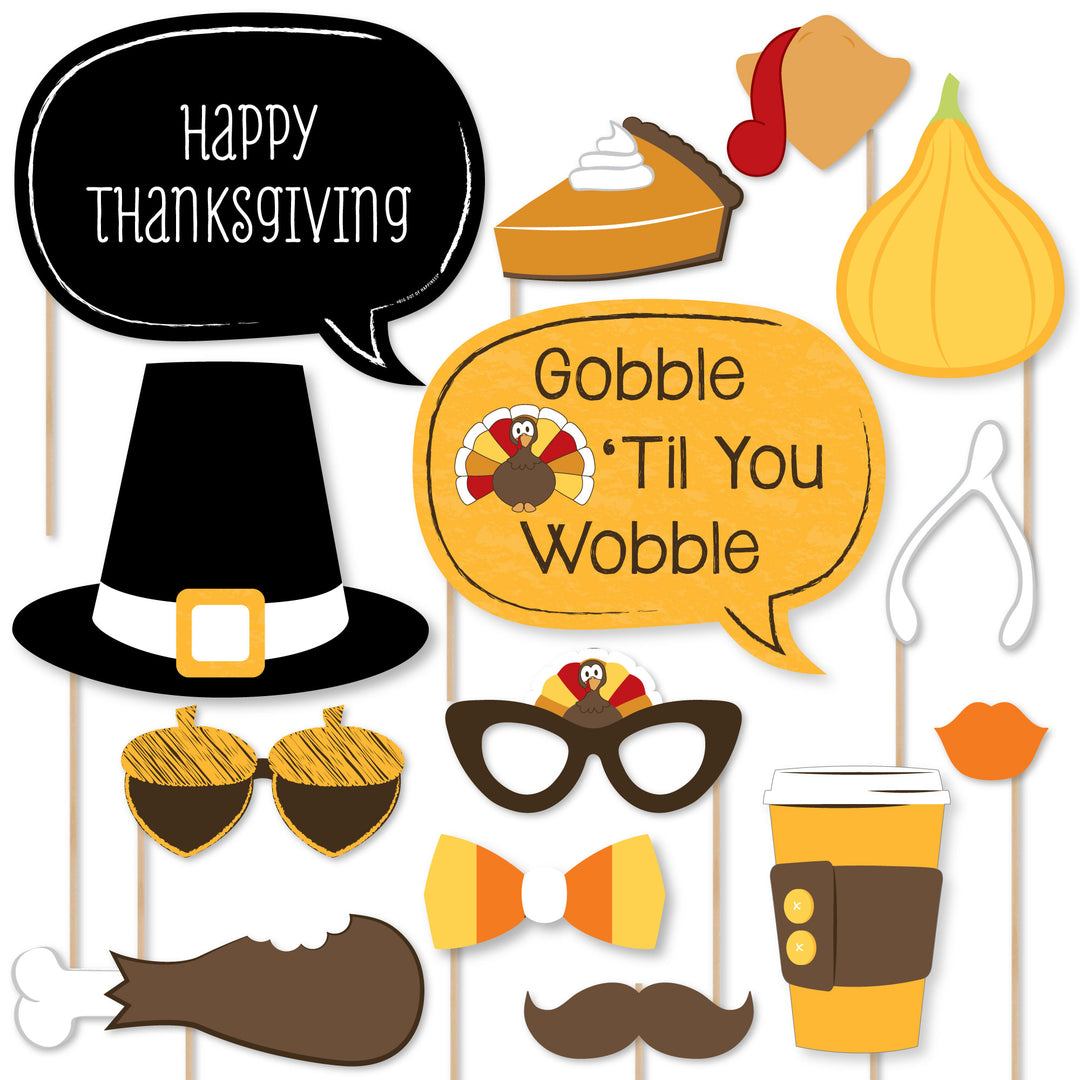 A collection of printed and cut Thanksgiving-themed photo booth props, including glasses, mustaches, bow ties, lips, hats, and other items with Thanksgiving-related designs.