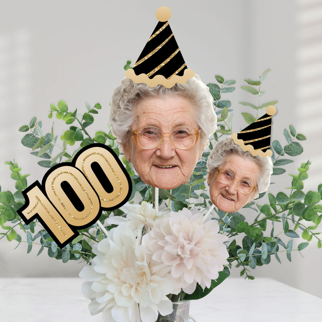 100th birthday party table styled with custom face centerpieces