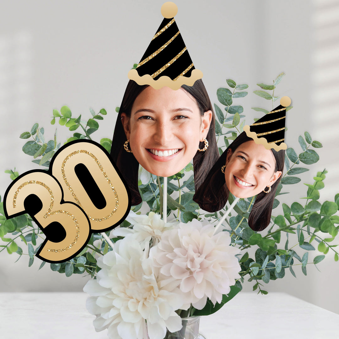 30th birthday celebration table decorated with custom face centerpieces