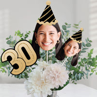 30th birthday celebration table decorated with custom face centerpieces
