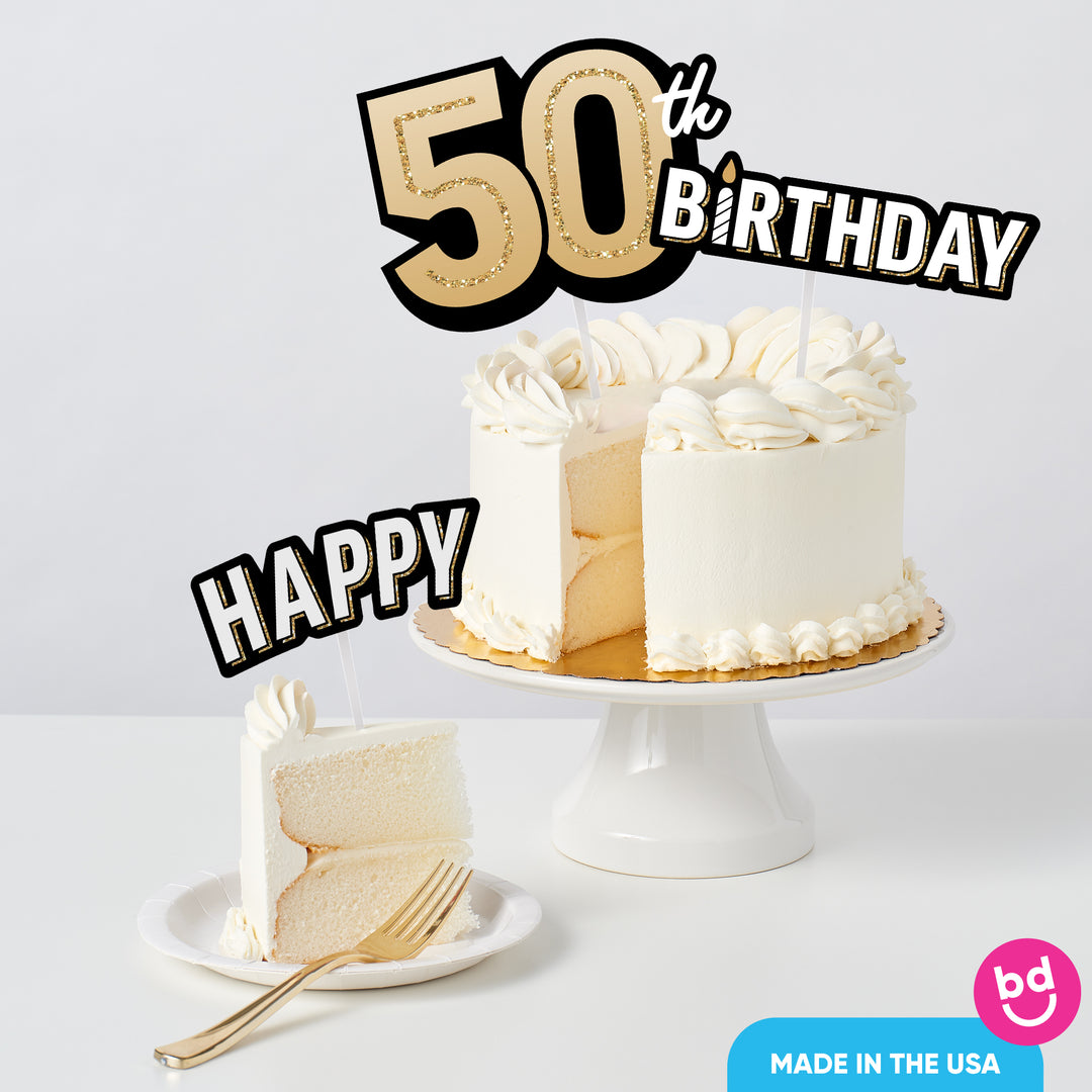 Adult 50th birthday cake decorated with black and gold toppers