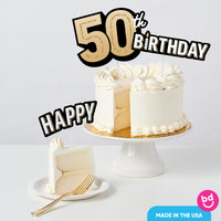 Adult 50th birthday cake decorated with black and gold toppers