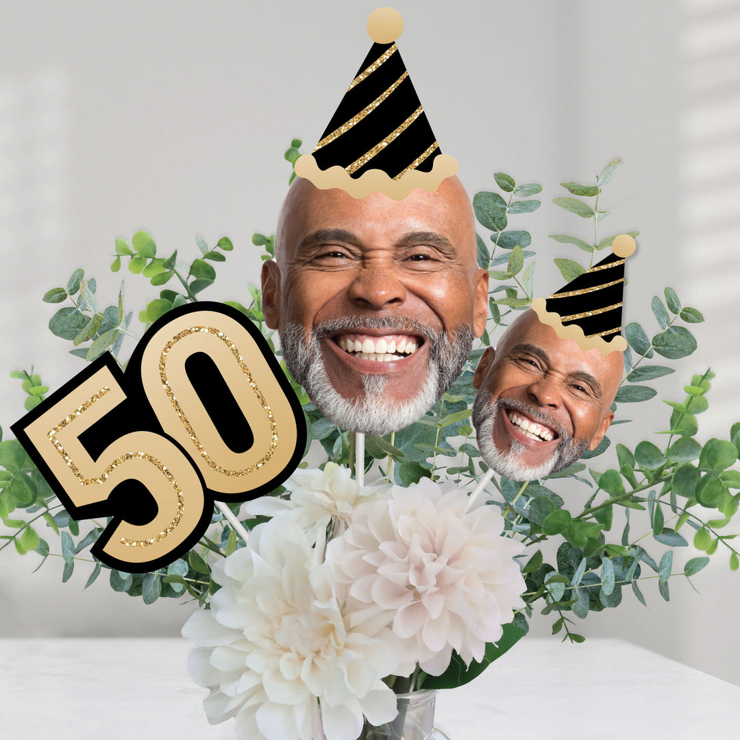 50th birthday dessert table styled with custom face decorations