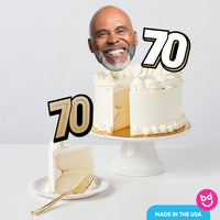 Adult 70th birthday cake decorated with gold toppers