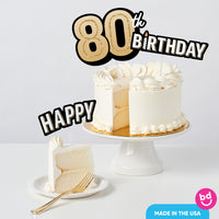 Adult 80th birthday cake styled with black and gold toppers