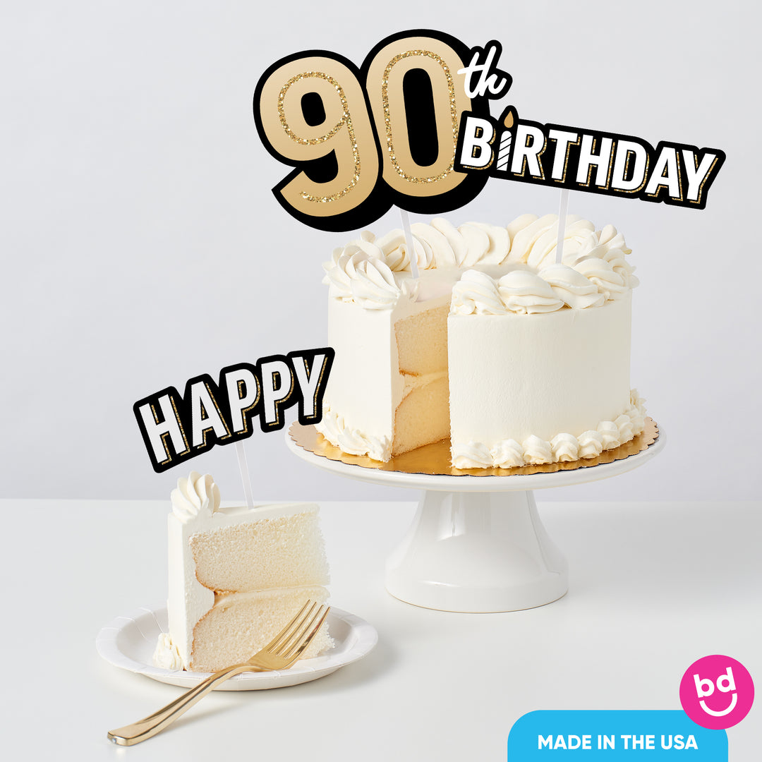 Adult 90th birthday cake decorated with gold toppers