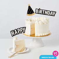 Adult birthday cake styled with black and gold toppers
