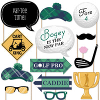 A collection of golf-themed photo booth props including signs, hats, glasses, and mustaches arranged against a white background.