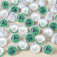 An array of round candy stickers with green designs, text, and golfing symbols, displayed on a white background.