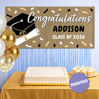 Black graduation banner displayed at party