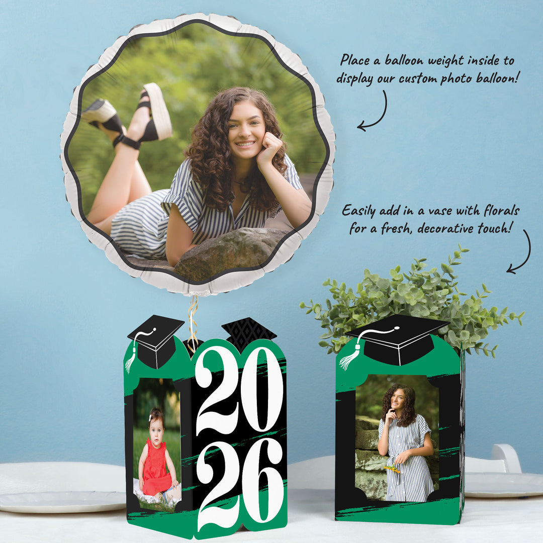 Green graduation table decor with photo centerpieces