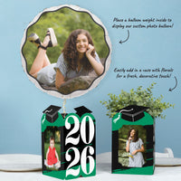 Green graduation table decor with photo centerpieces