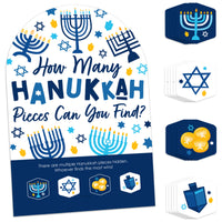A display of a Hanukkah themed party game which includes a sign with the text 'How Many Hanukkah Pieces Can You Find?' and multiple hexagon-shaped game pieces with Hanukkah symbols and elements.
