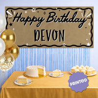 Birthday party backdrop behind dessert table